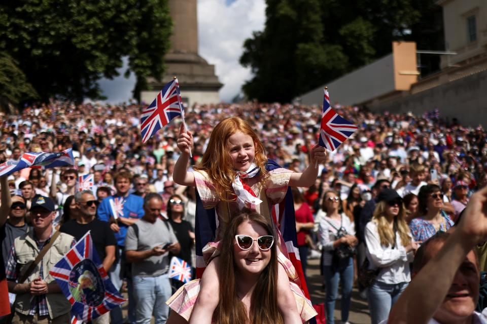 People attend celebrations of Britain's Queen Elizabeth's Platinum Jubilee, along The Mall (REUTERS)