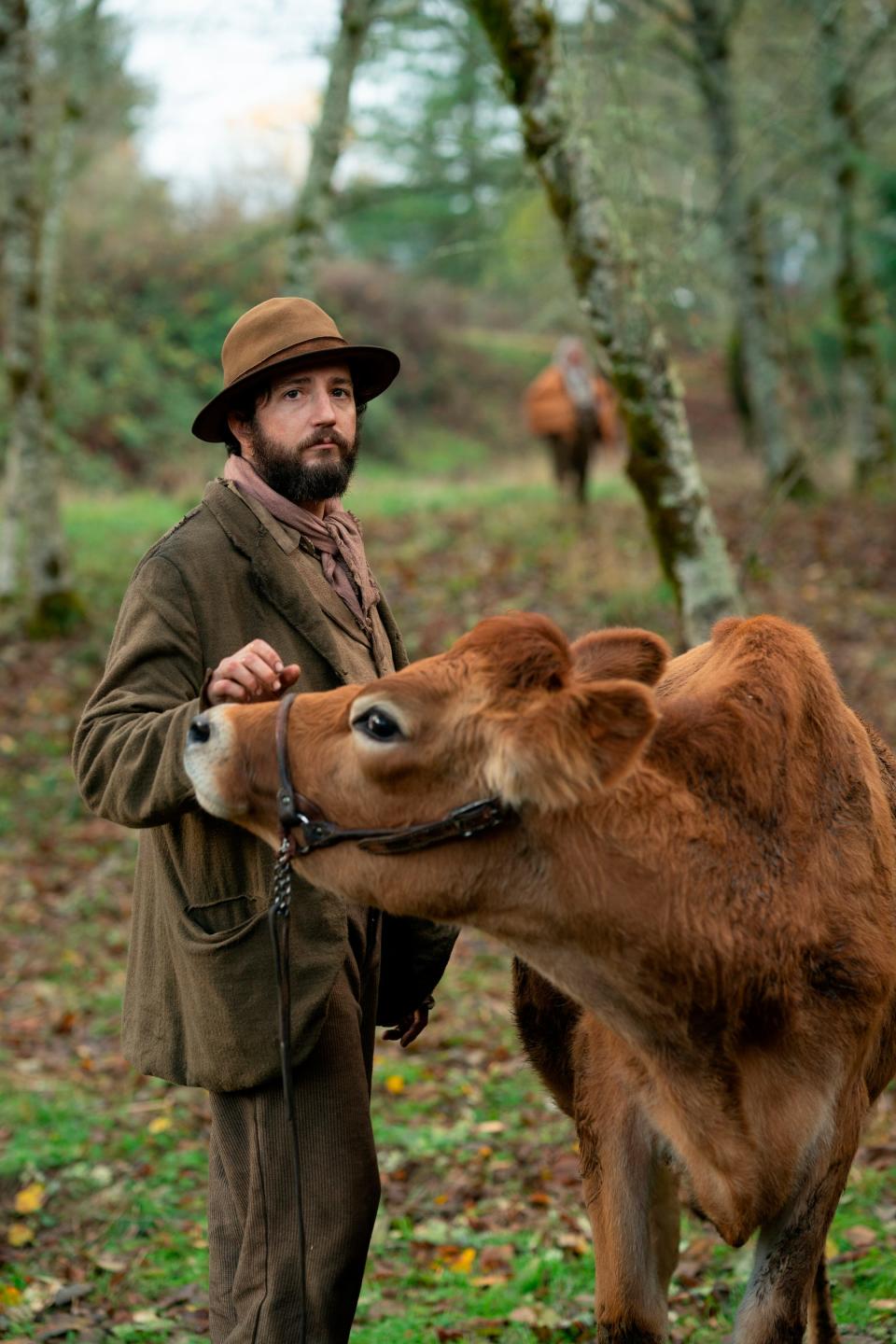 This image released by A24 shows John Magaro in a scene from the film "First Cow." (Allyson Riggs/A24 via AP)