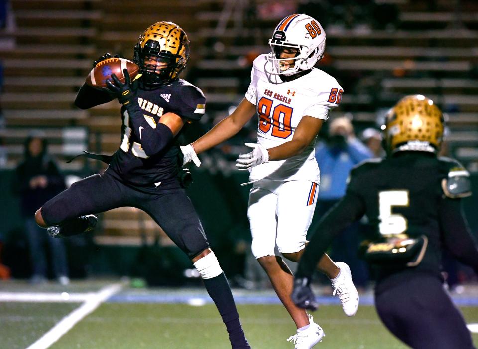 Eagles defensive back Jayson Henley intercepts a pass meant for San Angelo Central wide receiver Kevin Rice during a game at Shotwell Stadium on Nov. 4.