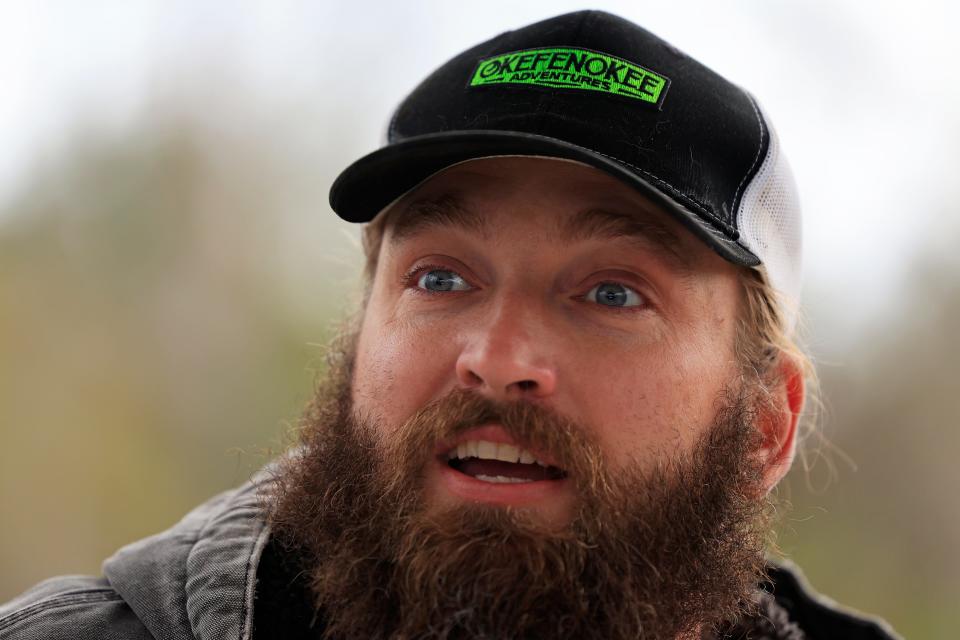 Eric Looft, environmental education coordinator and operations manager at the Okefenokee Swamp Park & Adventures, talks about the Okefenokee during a boat tour. [Corey Perrine/Florida Times-Union]