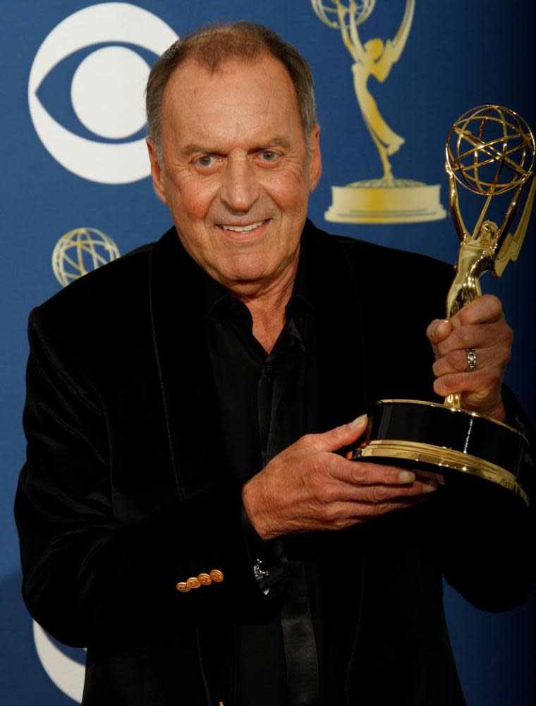 Bruce Gowers holding an Emmy award