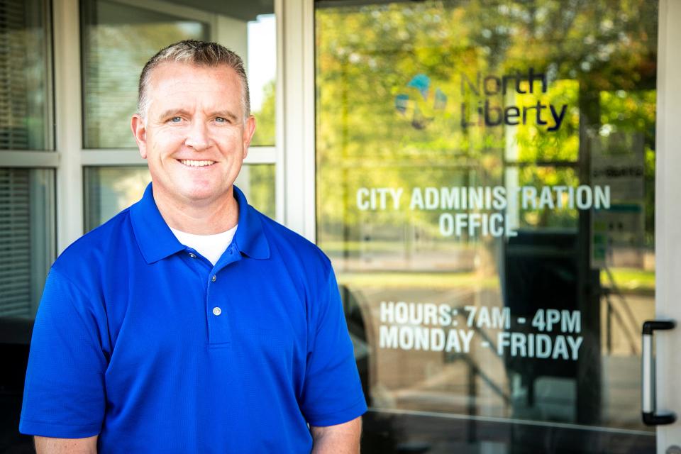 Chris Hoffman poses for a photo, Wednesday, Sept. 22, 2021, outside the North Liberty City Administration Office in North Liberty, Iowa.