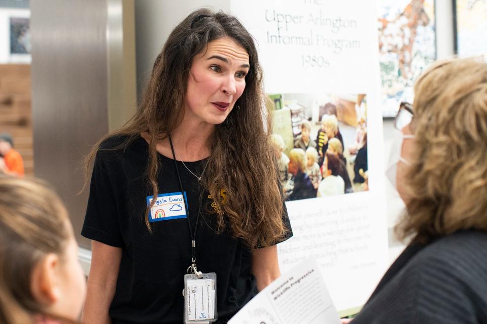 Angela Evans, principal at Wickliffe Progressive Elementary School in Upper Arlington, talks to parents during the school's recent open house to celebrate 50 years of informal education programming there.