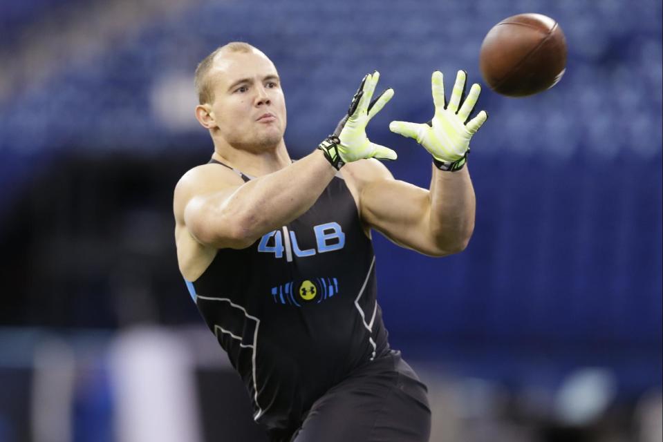 Wisconsin linebacker Chris Borland runs a drill at the NFL football scouting combine in Indianapolis, Monday, Feb. 24, 2014. (AP Photo/Michael Conroy)