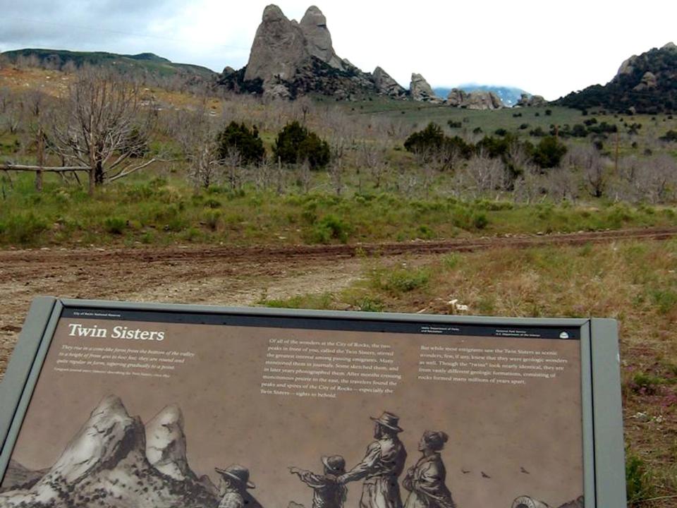 A plaque depicting pioneers viewing the spires of the Twin Sisters granite formation in the City of Rocks National Reserve, Idaho, is shown June 14, 2006. A national climbing organization is asking the Park Service to reconsider its 1998 ban on climbing the Twin Sisters, which are considered natural historic landmarks along the California Trail. ()