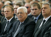 <p>Palestinian President Mahmoud Abbas (C) sits alongside European Council President Donald Tusk (L) and President of Romania is Klaus Iohannis (R) as they attend the funeral of Shimon Peres at Mount Herzl Cemetery on September 30, 2016 in Jerusalem, Israel. (Abir Sultan- Pool/Getty Images) </p>