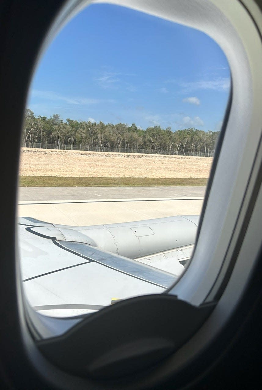 View of airplane window from Tulum airport