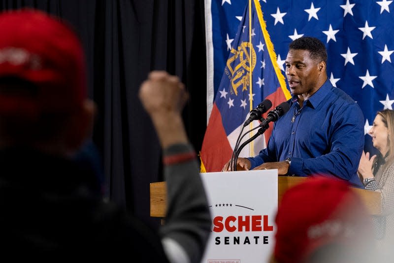 Republican candidate for U.S. Senate Herschel Walker speaks during a campaign stop at the Governors Gun Club in Kennesaw, Ga., on Monday, Dec. 5, 2022.