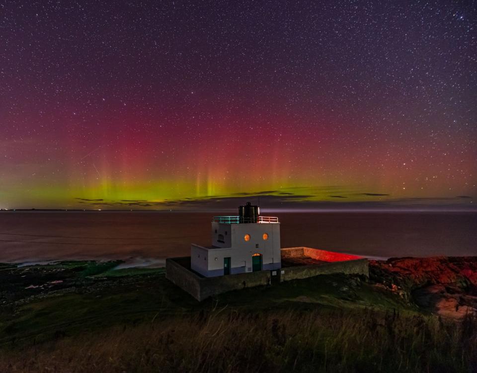 The Northern Lights over Bamburgh’s lighthouse (Getty Images/iStockphoto)