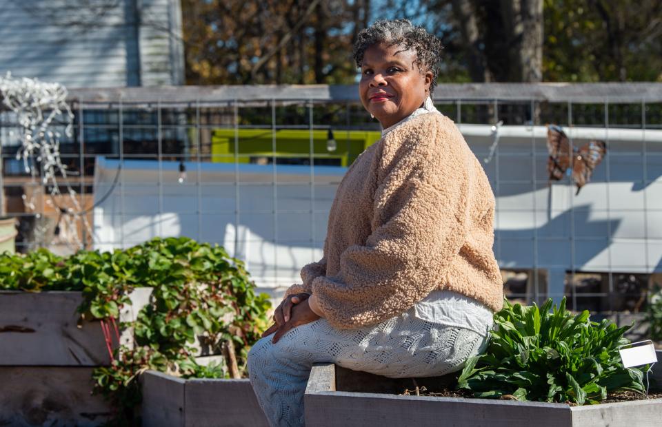 Nella Frierson is protecting her community of Brooklyn Heights in Nashville, Tenn., by buying property around her neighborhood to prevent gentrification, she sits in the community garden, Saturday, Nov. 27, 2021.