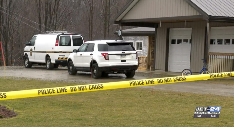 This image taken from video shows police vehicles on the Fish Flats property, a few miles outside Spartansburg, Pa., Feb. 27, 2024. Investigators have no suspects in the killing of a pregnant 23-year-old Amish woman inside her home in rural northwestern Pennsylvania, and are appealing for tips from the public to help solve the crime, a state police spokeswoman said Wednesday. (Craig Rouse/WJET via AP)