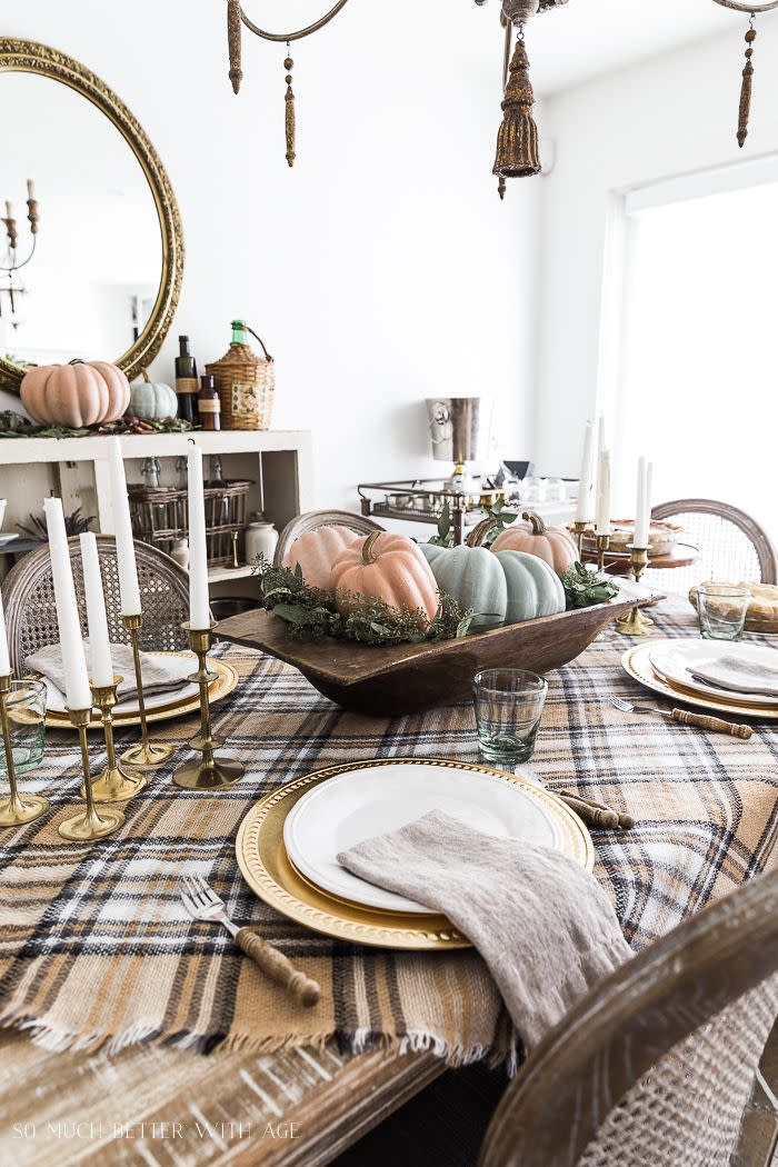 <p>A pretty plaid tablecloth, muted color pumpkins, and vintage elements make for a simply stunning tablescape. </p><p><strong><em><a href="https://somuchbetterwithage.com/vintage-thanksgiving-table/" rel="nofollow noopener" target="_blank" data-ylk="slk:Get the tutorial at So Much Better With Age;elm:context_link;itc:0;sec:content-canvas" class="link ">Get the tutorial at So Much Better With Age</a>. </em></strong></p><p><a class="link " href="https://www.amazon.com/Floral-Charger-13-Inch-Elegant-Chargers/dp/B08D9W1QRN?tag=syn-yahoo-20&ascsubtag=%5Bartid%7C10070.g.23289609%5Bsrc%7Cyahoo-us" rel="nofollow noopener" target="_blank" data-ylk="slk:SHOP GOLD CHARGERS;elm:context_link;itc:0;sec:content-canvas">SHOP GOLD CHARGERS</a></p>
