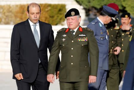 Jordan's King Abdullah (C) arrives for the ceremony of reopening the Martyrs' Memorial and Museum in Amman, Jordan, December 12, 2016. REUTERS/Muhammad Hamed