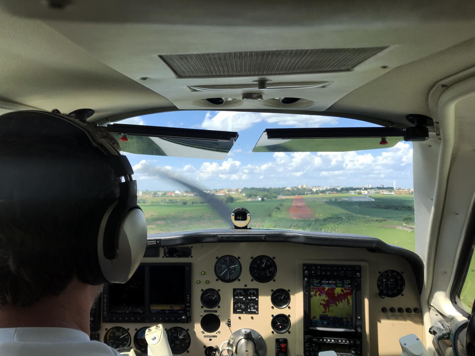 Cockpit point of view of small plane.