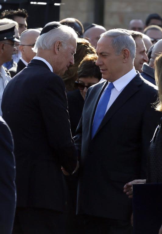 Israeli Prime Minister Benjamin Netanyahu (right) shakes hands with US Vice President Joe Biden during a memorial ceremony for former Israeli premier Ariel Sharon outside the Knesset (Israeli Parliament) in Jerusalem, on January 13, 2014