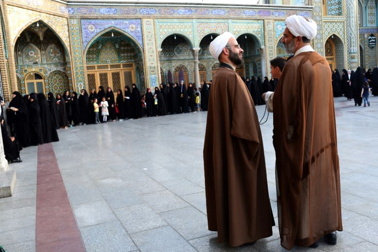 Iranian women prepare to vote in the holy city of Qom on May 19, 2017