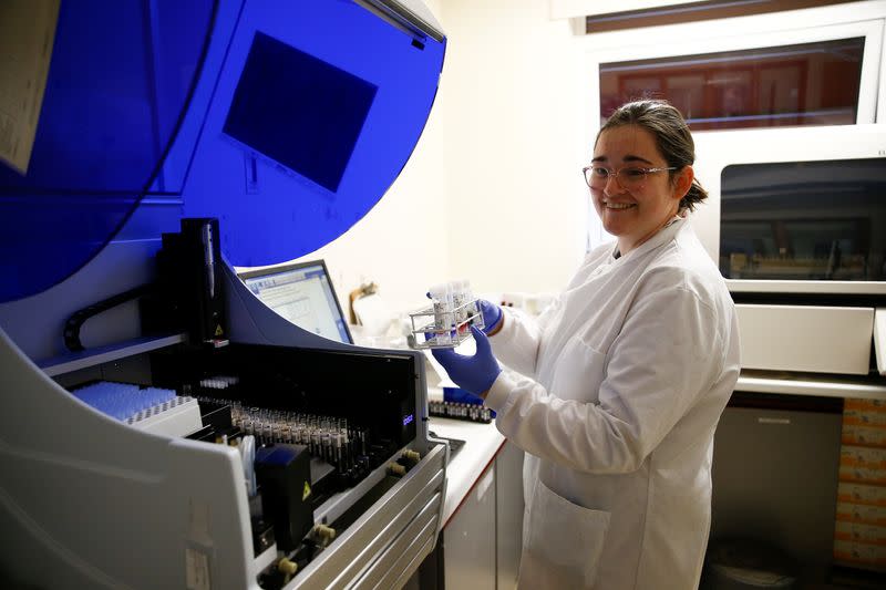 A medical worker tests swabs for the novel coronavirus at the Microbiology department of North Devon District Hospital in Barnstaple