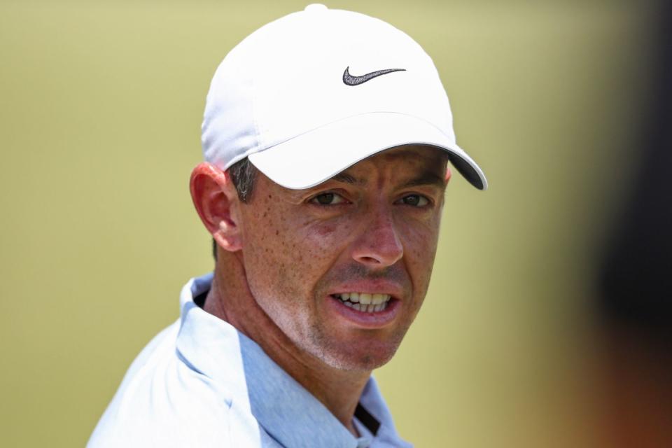 <p>Jared C. Tilton/Getty</p> Rory McIlroy of Northern Ireland walks off fifth green at Pinehurst Resort on June 11, 2024