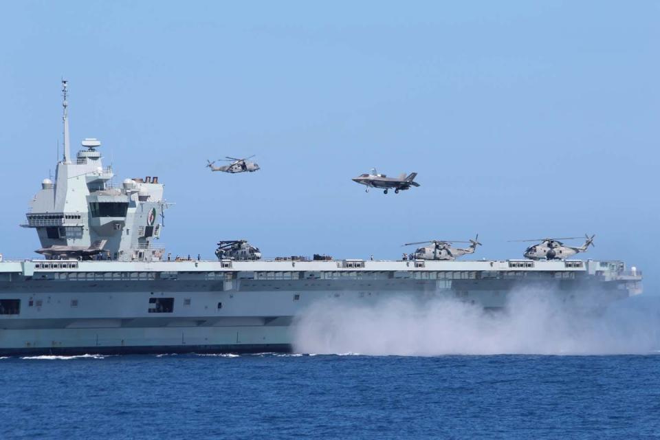 F-35 fighter jet over HMS Queen Elizabeth aircraft carrier