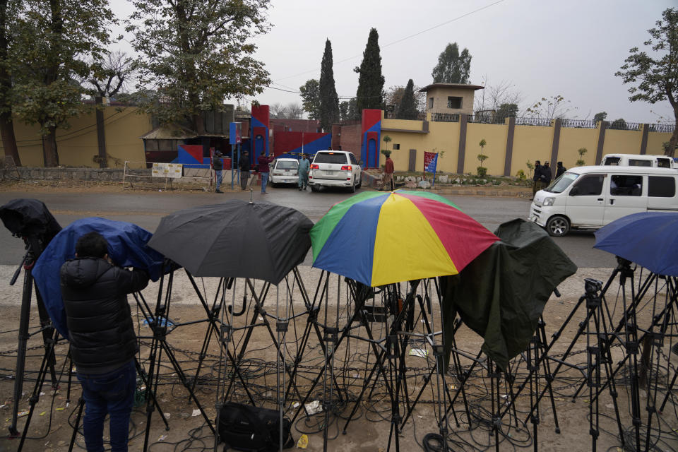 Cameras of news channels are fixed outside the Adiyala prison, where a special court proceeding going on for a case against Pakistan's Former Prime Minister Imran Khan, in Rawalpindi, Pakistan, Tuesday, Jan. 30, 2024. A Pakistani court on Tuesday sentenced former Prime Minister Khan and one of his party deputy to 10 years in prison each, after finding them guilty of revealing official secrets. (AP Photo/Anjum Naveed)