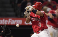 Los Angeles Angels' Albert Pujols is hit by a pitch during the eighth inning of the team's baseball game against the Seattle Mariners on Friday, April 19, 2019, in Anaheim, Calif. (AP Photo/Mark J. Terrill)