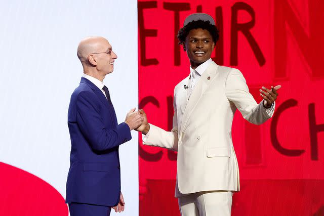 <p>Sarah Stier/Getty</p> NEW YORK, NEW YORK - JUNE 22: Amen Thompson (R) poses with NBA commissioner Adam Silver (L) after being drafted fourth overall pick by the Houston Rockets during the first round of the 2023 NBA Draft at Barclays Center on June 22, 2023 in the Brooklyn borough of New York City.