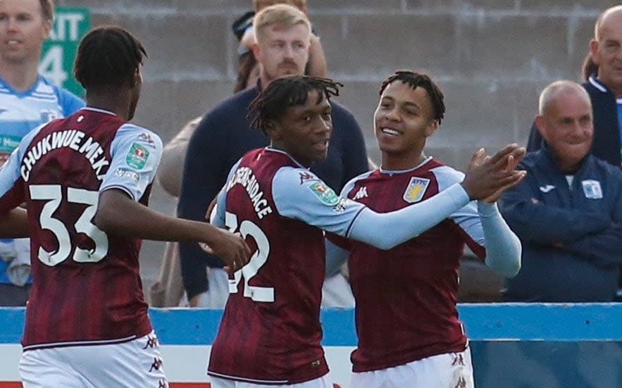 Jaden Philogene (centre) celebrates scoring for Aston Villa in 2021