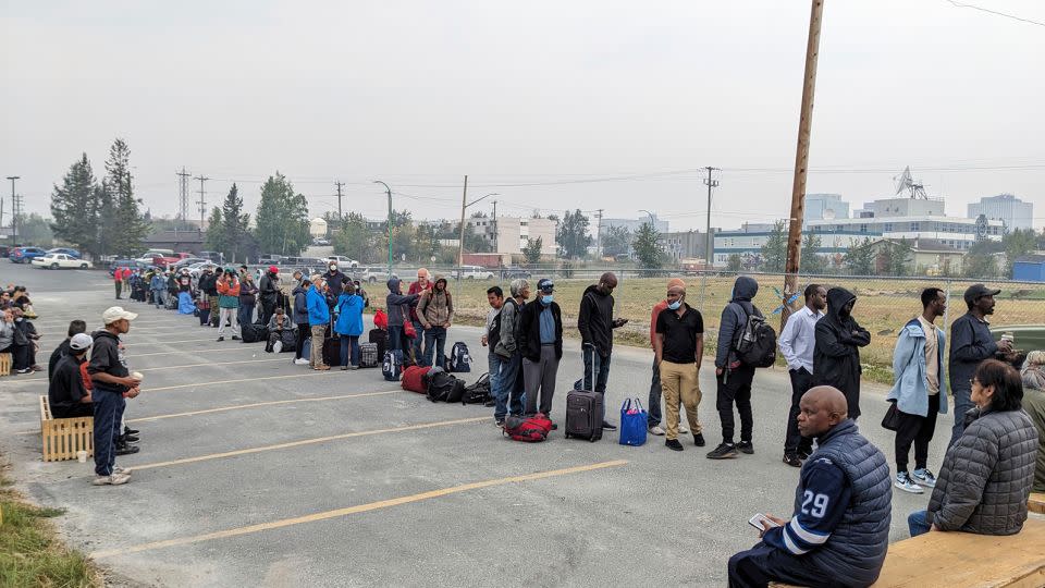 People line up in Yellowknife to register for an evactuation flight on August 17.  - Bill Braden/The Canadian Press/AP