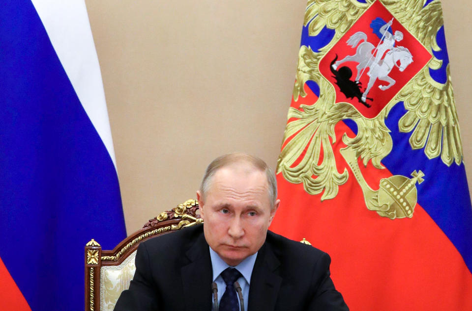 Russian President Vladimir Putin leads a cabinet meeting in the Kremlin in Moscow, Russia, Tuesday, March 17, 2020. (Mikhail Klimentyev, Sputnik, Kremlin Pool Photo via AP)