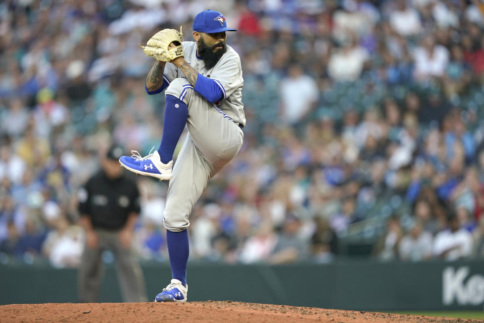 Toronto Blue Jays relief pitcher Sergio Romo winds up during the fourth inning of the team's baseball game against the Seattle Mariners, Thursday, July 7, 2022, in Seattle. (AP Photo/Ted S. Warren)