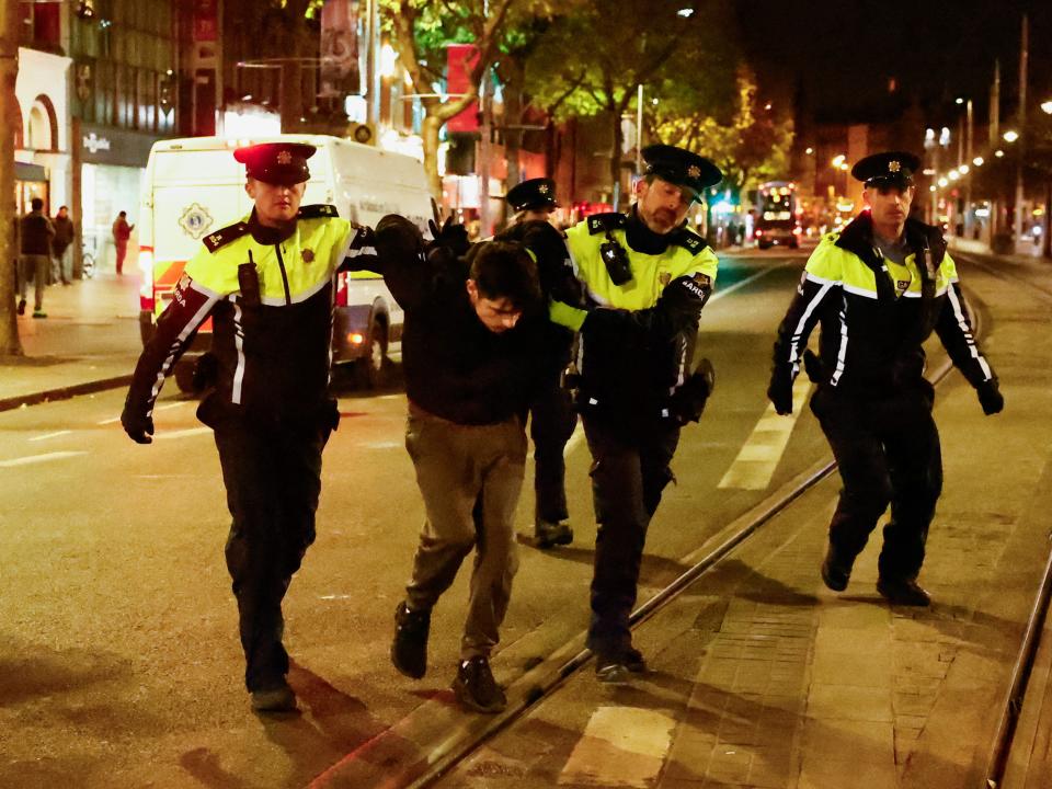 Members of the Garda Public Order Unit detain a man on Friday, following a riot in the aftermath of a school stabbing that left several children and adults injured, in Dublin, Ireland (REUTERS)