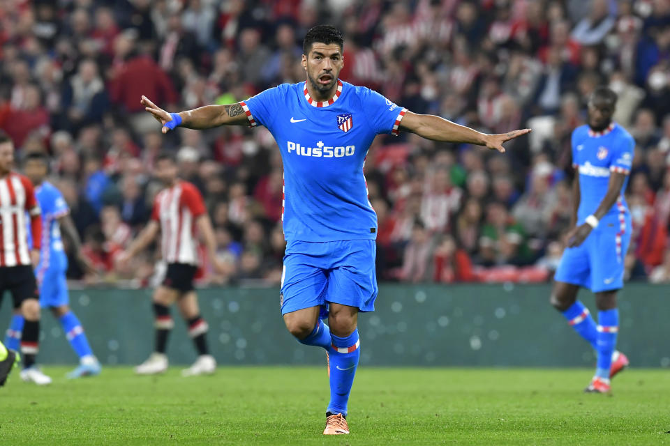 FILE - Atletico Madrid's Luis Suarez gestures during a Spanish La Liga soccer match between Athletic Club Bilbao and Atletico Madrid at the San Mames stadium in Bilbao, Spain, Saturday, April 30, 2022. (AP Photo/Alvaro Barrientos, File)