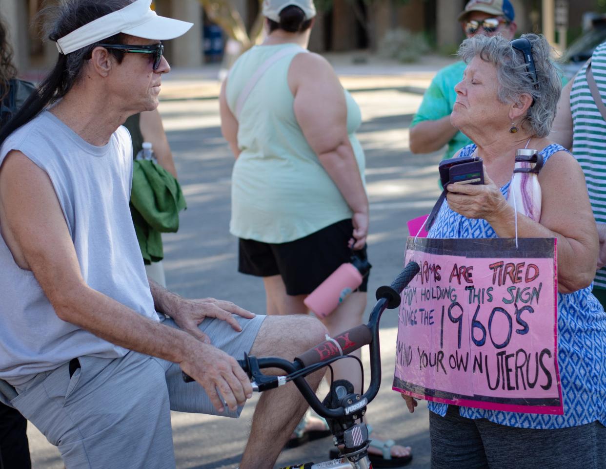 Anti-abortion activist John Barnwell of Palm Desert is confronted by abortion-rights protester Marilyn Markovich at the Rise Up 4 Abortion Rights protest in Palm Desert, Calif., on July 1, 2022.