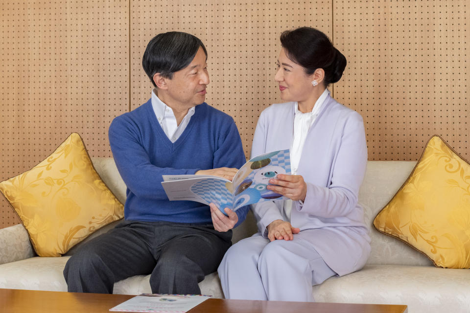 In this photo provided on Feb. 18, 2021, by the Imperial Household Agency of Japan, Japan's Emperor Naruhito, left, and Empress Masako talk at Akasaka Palace in Tokyo on Feb. 2, 2021. Naruhito celebrated 61st birthday on Tuesday, Feb. 23, 2021. (The Imperial Household Agency of Japan via AP)