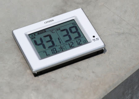 A temperature indicator measures 43.1 degrees Celsius, placed on the surface of the spectators' stand at the construction site of the New National Stadium, the main stadium of Tokyo 2020 Olympics and Paralympics, during a media opportunity in Tokyo, Japan July 18, 2018. REUTERS/Issei Kato