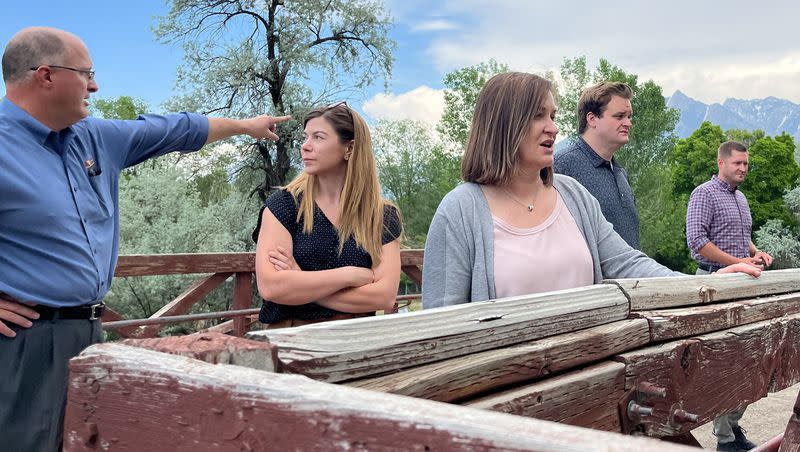 Salt Lake County Mayor Jenny Wilson stands at the top of a tiny dam at Wheeler Historic Farm. Salt Lake County officials are moving their emergency flood command center operations to Wheeler Historic Farm.