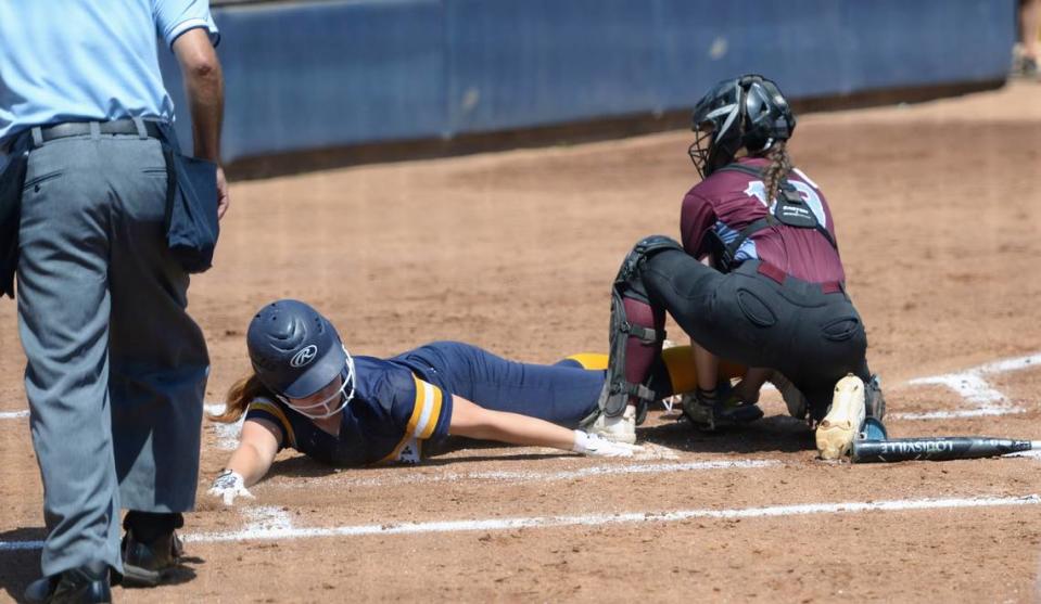 Big Valley Christian’s Macie Stevens reaches for home plate during the Sac-Joaquin Section Division VII championship against No. 3 Buckingham Charter at Cosumnes River College on Saturday, May 18, 2024.