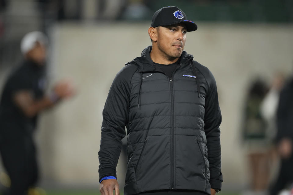 Boise State head coach Andy Avalos warms up before an NCAA college football game Saturday, Oct. 14, 2023, in Fort Collins, Colo. (AP Photo/David Zalubowski)