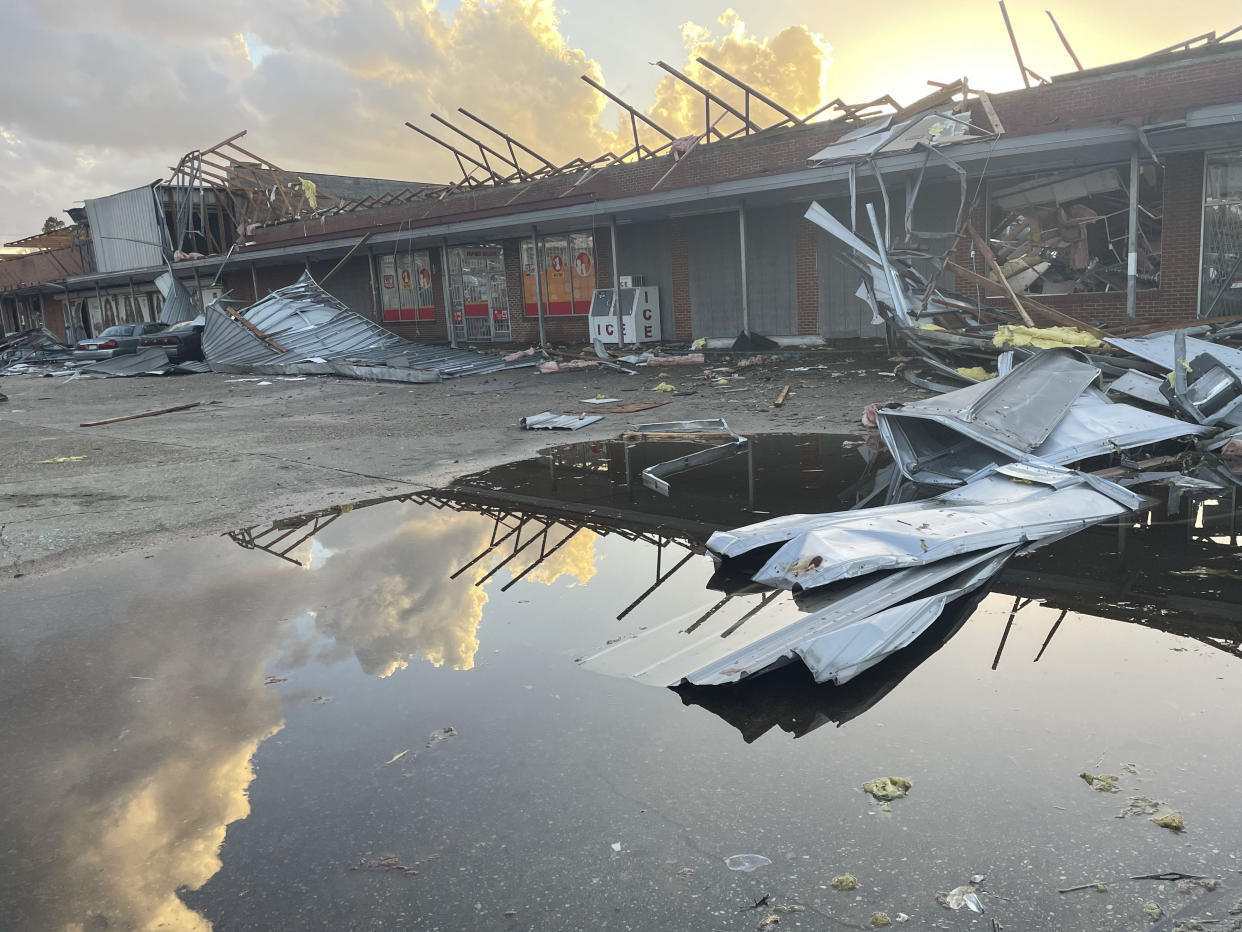 A damaged structure and debris are seen in the aftermath of severe weather, Thursday, Jan. 12, 2023, in Selma, Ala. A large tornado damaged homes and uprooted trees in Alabama on Thursday as a powerful storm system pushed through the South. (AP Photo/Butch Dill)