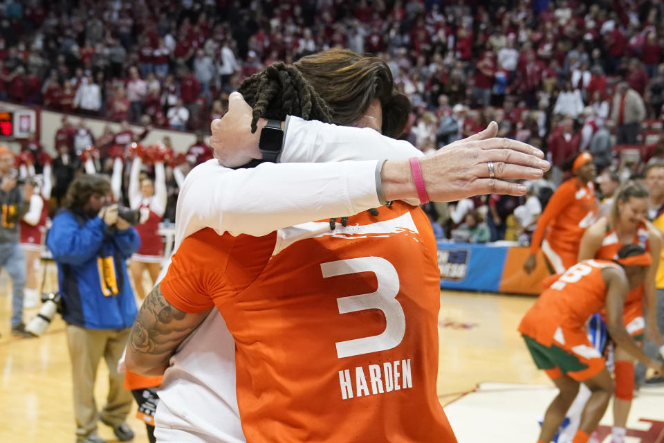 Miami head coach Katie Meier celebrates with Destiny Harden after Miami defeating Indiana in a second-round college basketball game in the women's NCAA Tournament Monday, March 20, 2023, in Bloomington, Ind. (AP Photo/Darron Cummings)