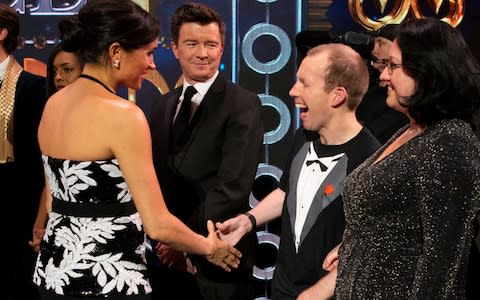 The Duchess of Sussex meets Rick Astley and Lost Voice Guy on stage at the Royal Variety Performance  - Credit: PA