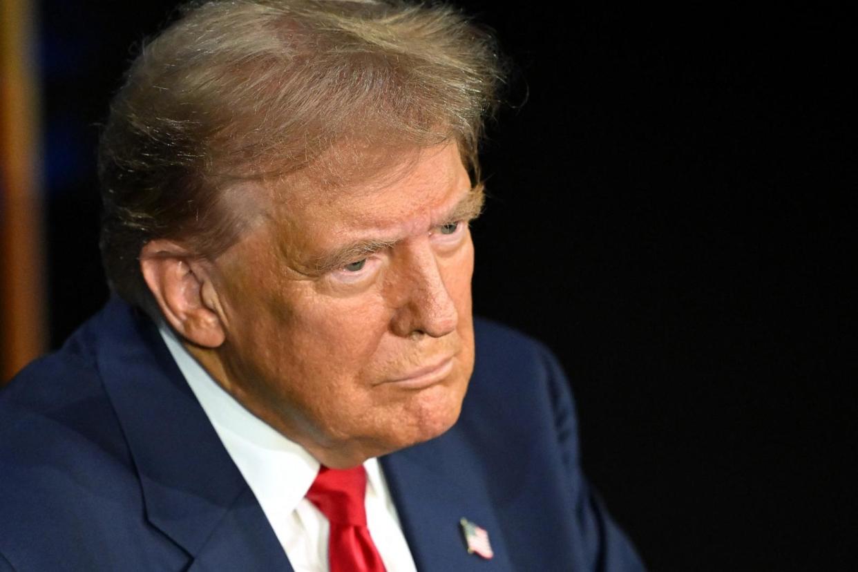 PHOTO: Former President and Republican presidential candidate Donald Trump listens during an ABC News presidential debate with Vice President and Democratic presidential candidate Kamala Harris in Philadelphia, on Sept. 10, 2024.  (Saul Loeb/AFP via Getty Images)