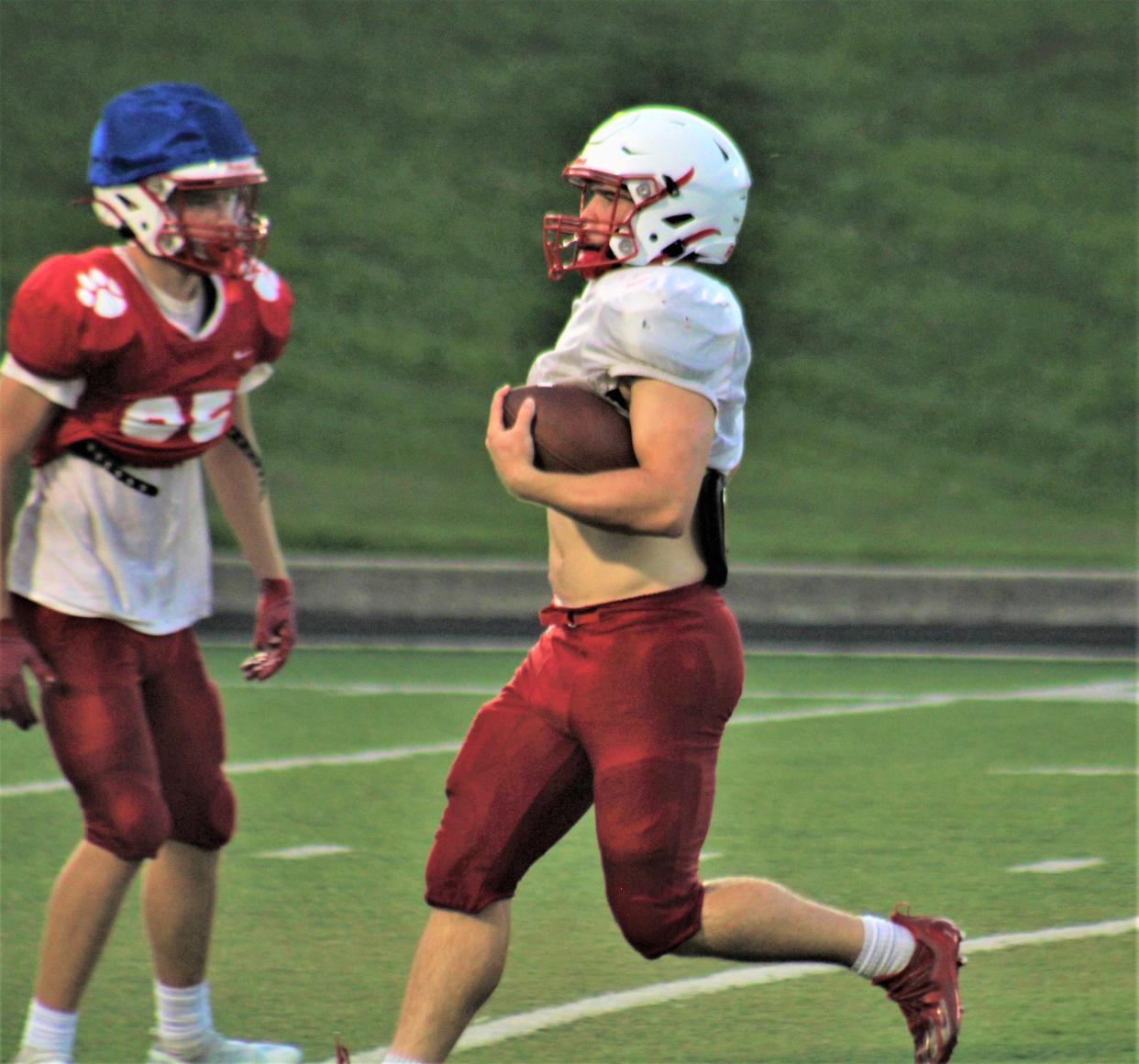 Beechwood senior Mitchell Berger runs after catching a pass. Berger, a versatile playmaker on both sides of the ball, is one of Beechwood's top players as the Tigers aim for a third-straight state championship. Beechwood High School held football practice August 2, 2022, at its stadium in Fort Mitchell, Ky.