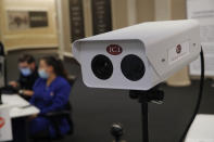 An infrared camera used to measure employee's temperatures is set up at an employee entrance during a closure due to the coronavirus at the Bellagio hotel and casino, Wednesday, May 20, 2020, in Las Vegas. Casino operators in Las Vegas are awaiting word when they will be able to reopen after a shutdown during the coronavirus outbreak. (AP Photo/John Locher)