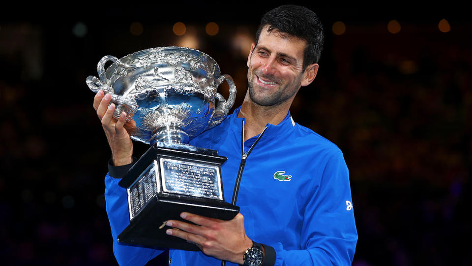 Novak Djokovic poses with the Norman Brookes Challenge Cup. (Photo by Julian Finney/Getty Images)