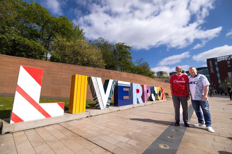 The Liverpool sign spotlighting the city's football heritage, unveiled by former Liverpool FC defender Mark Lawrenson and former Everton midfielder  Graham Stuart