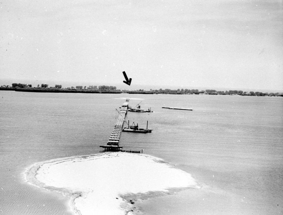 Construction of the Manatee Avenue Bridge in 1956. Barges were used to steady the structure.