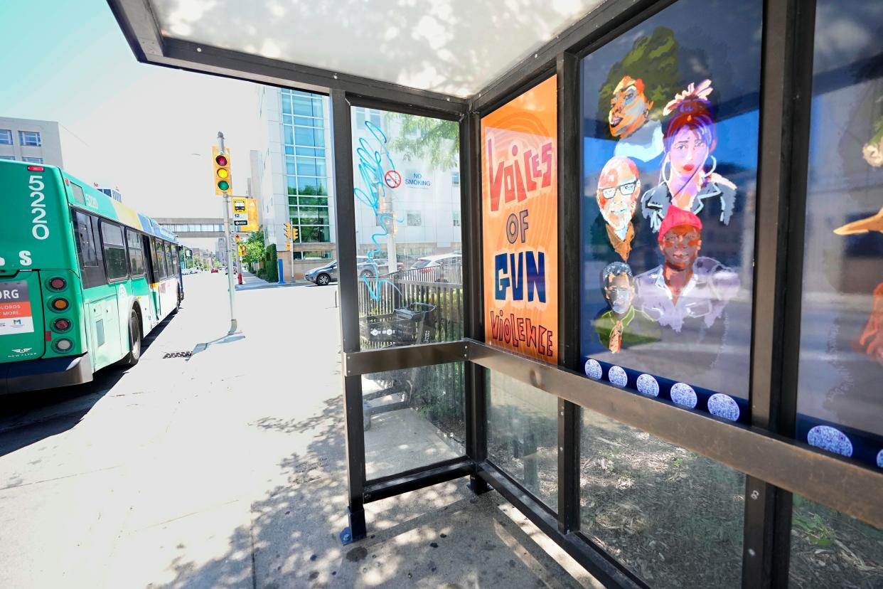 A new bus stop mural at North 6th Street and West Highland Avenue carrying a message that Milwaukee has a gun violence problem that needs to be stopped in Milwaukee on Thursday, June 23, 2022.