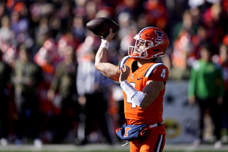 Illinois quarterback John Paddock passes during the first half of an NCAA college football game against Indiana on Saturday, Nov. 11, 2023, in Champaign, Ill. (AP Photo/Charles Rex Arbogast)