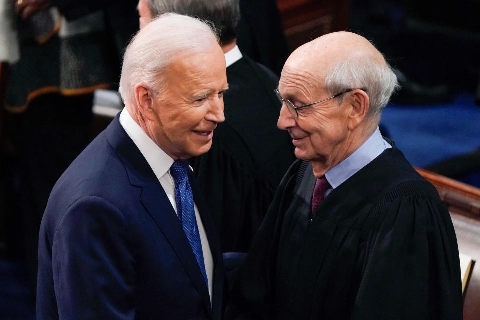 President Joe Biden greets Supreme Court Associate Justice Stephen Breyer as he arrives to deliver his first State of the Union address to a joint session of Congress, at the Capitol in Washington, DC, March 1, 2022.